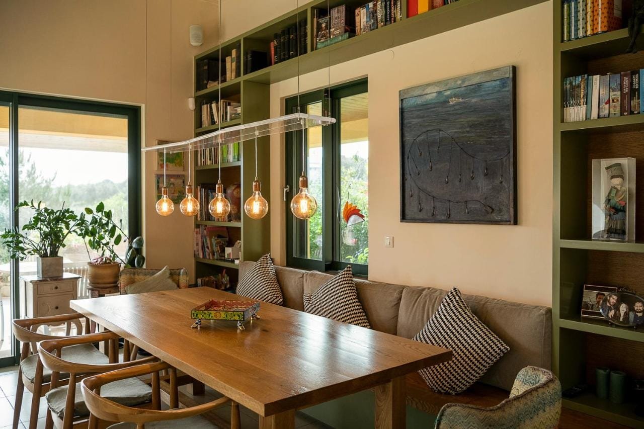Stone dining room with bookshelves