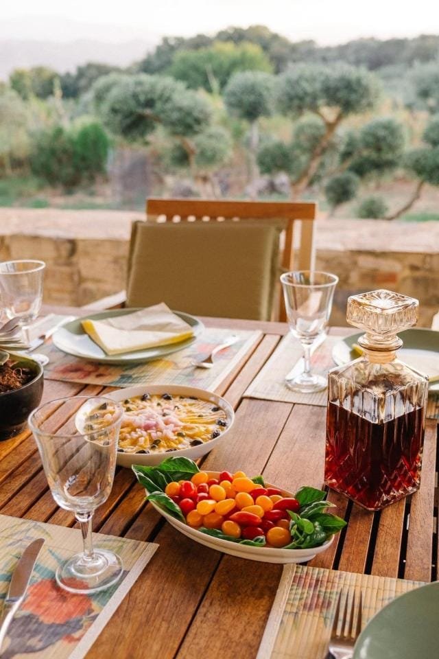 A table set for dinner on the terrace at Ariti Villa